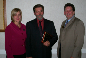 Owner Byron West with Gannon SBDC Director Debra Steiner and Jim Decker, CEO of WCCBI