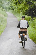 A bicylcist enjoys the scenery along the Hike-Bike Trail of Warren