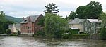 Houses and commercial buildings lining Conewango Creek